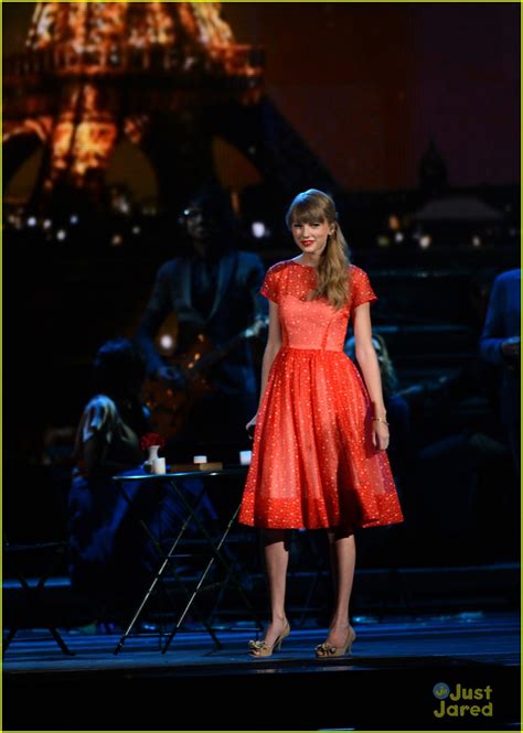 She also mentions Taylor in her song "Begin Again." Charles Sykes/AP Swift accepts the award for artist of the year at the 2011 American Music Awards in Los Angeles.